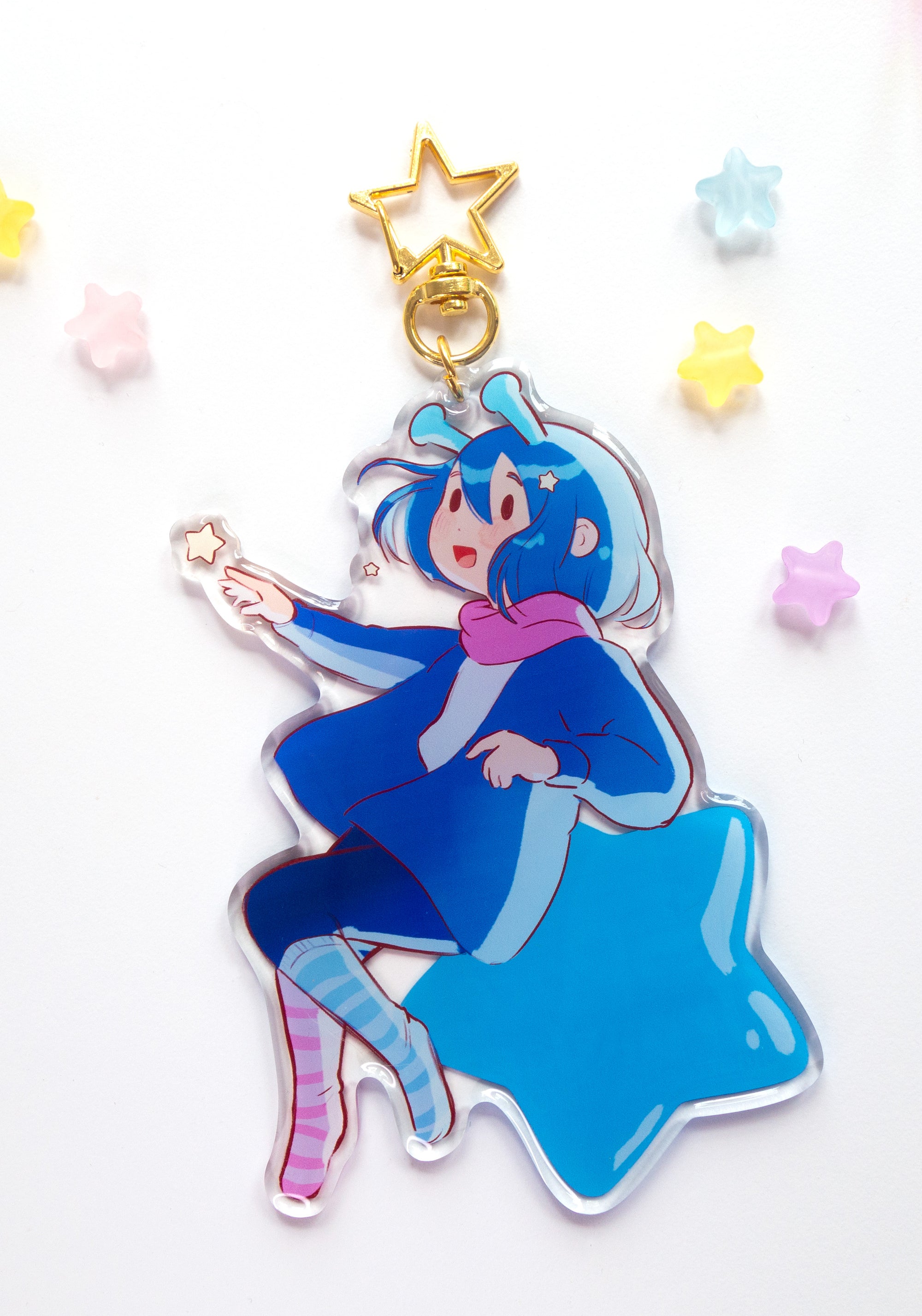 ADHD Alien acrylic charm backside design with a star-shaped base with colorful stars in the background
