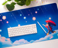 Blue desk mat with ADHD Alien cartoon character and keyboard on a white surface