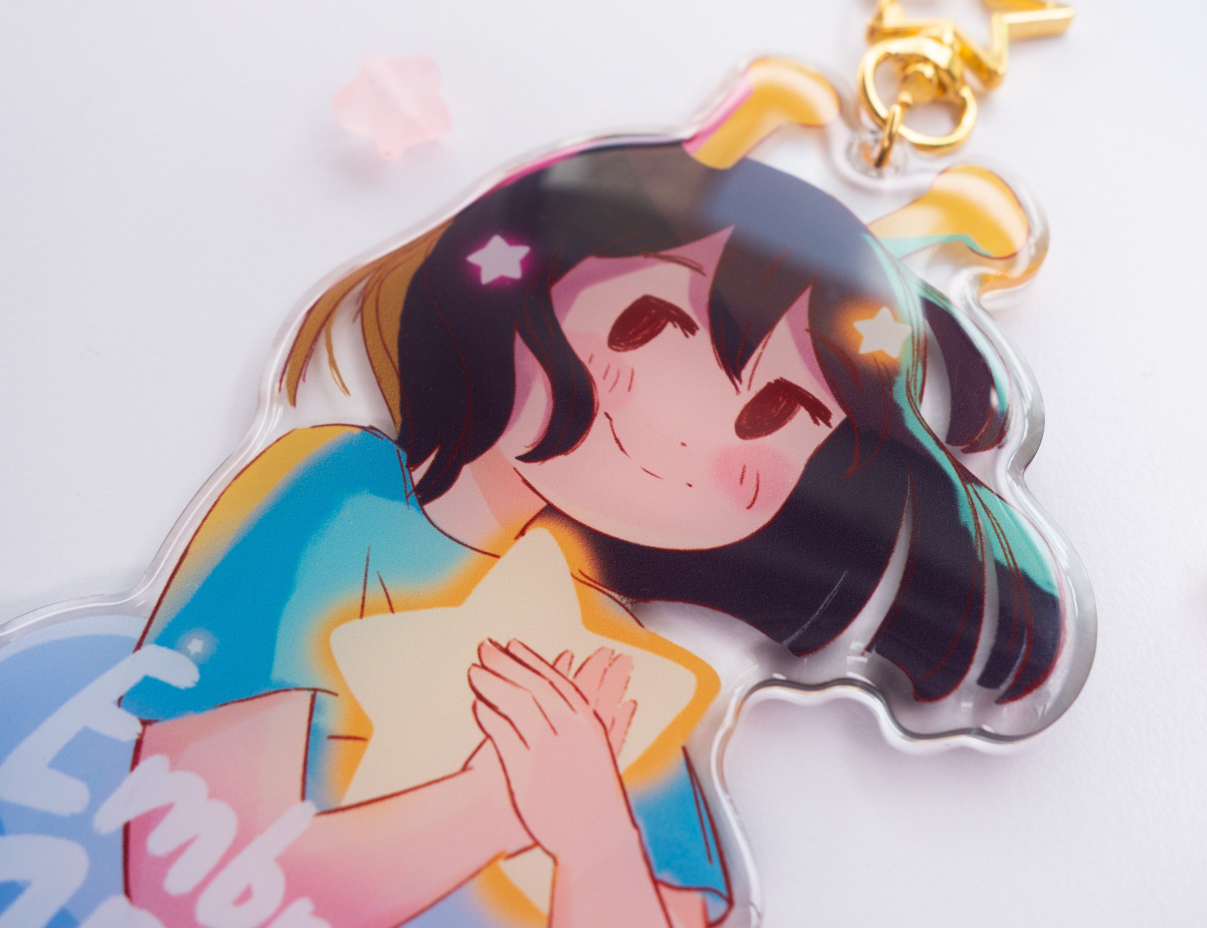 Close-up of acrylic charm with a decorative star on a white background