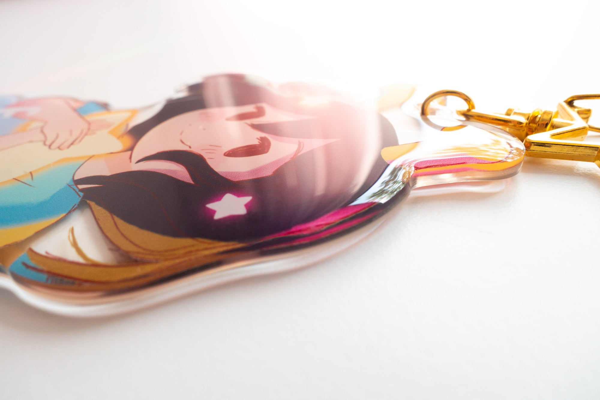 Detail shot of the keychain with the ADHD Alien character design on a white background