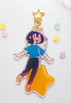 ADHD Alien acrylic charm backside design on a star-shaped base with colorful stars in the background