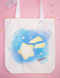 Tote bag with aquarell star design and 'ADHD Alien' text on a pink background