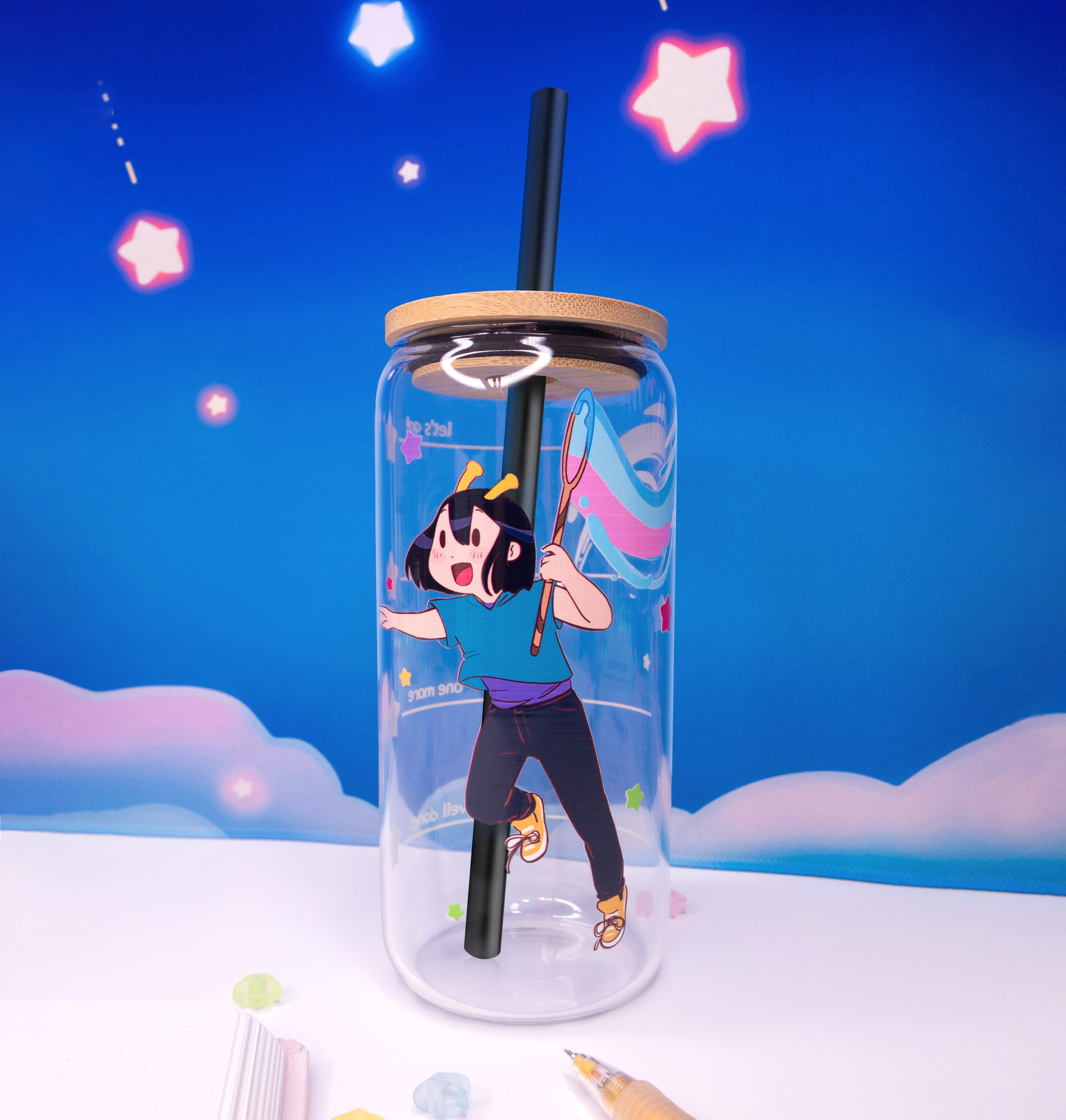 Glass tumbler with the ADHD Alien character illustration against a colorful sky background